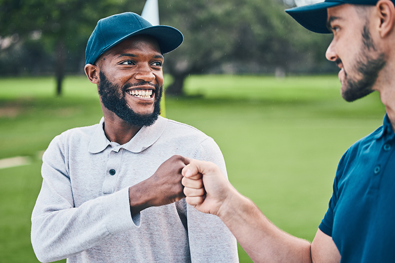 Two men bumping fists