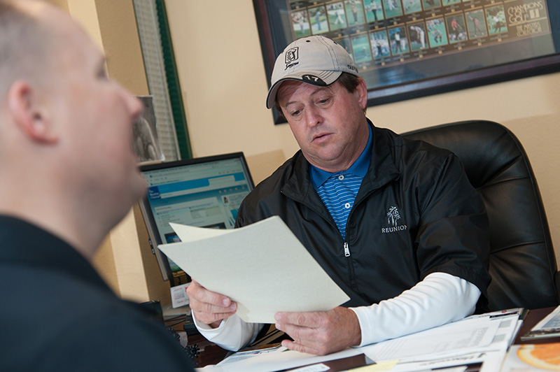 Superintendent examining resume
