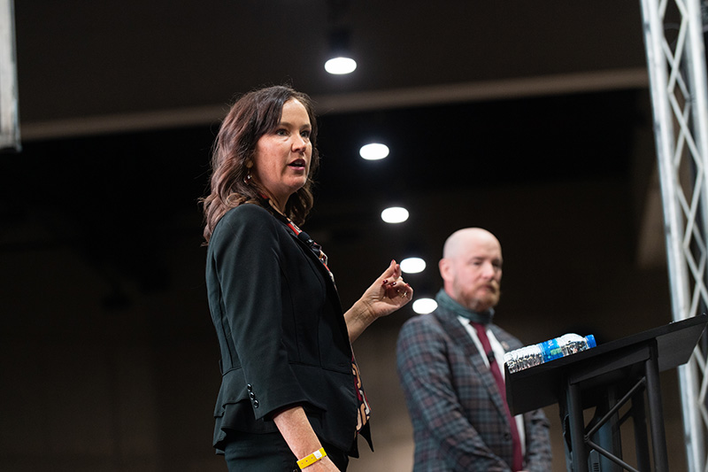 Carol D. Rau speaking onstage