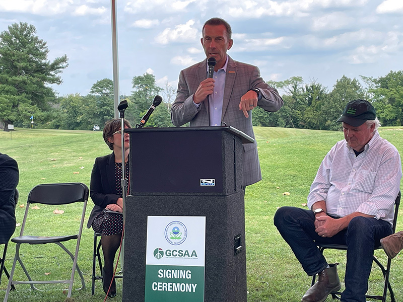 Rhett Evans speaking at MOU signing event