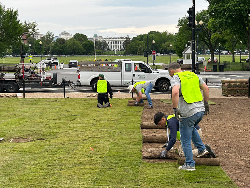 Volunteers lay sod on the National Mall during National Golf Day Community Service Project