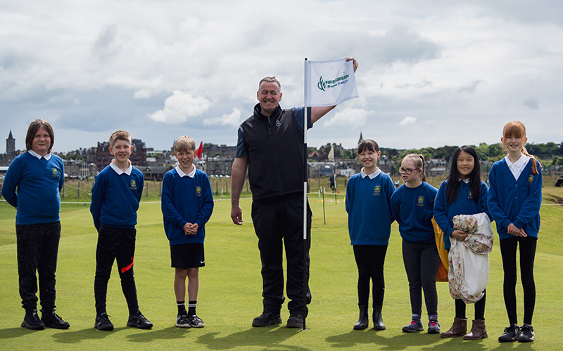 School children and Gordon McKie outside at St. Andrews Links