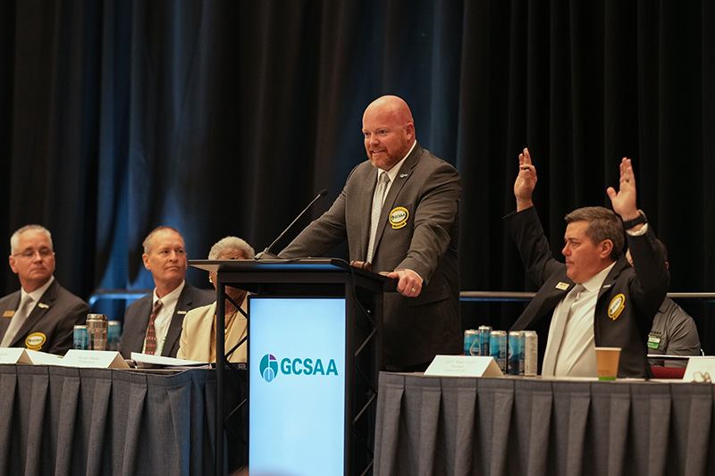 GCSAA board members seated at a table during the annual meeting
