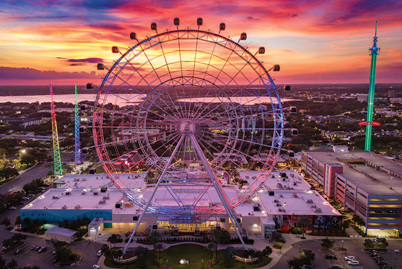Nighttime image of a large ferris wheel at ICON Park in Orlando, Florida