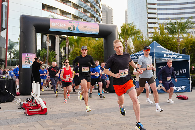 Runners crossing the finish line of a 5K race