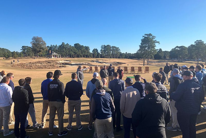 Green Start Academy attendees listening to a speaker outdoors on the Cradle course at Pinehurst