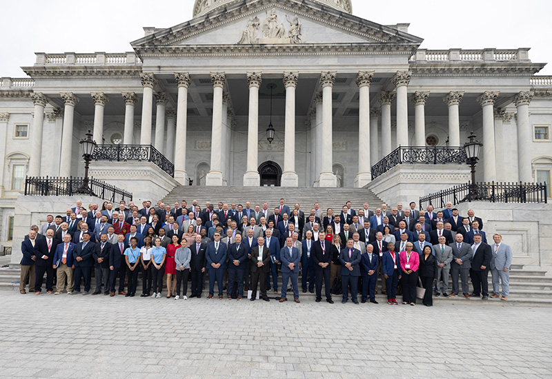 Group of National Golf Day participants standing outside the United States capitol building