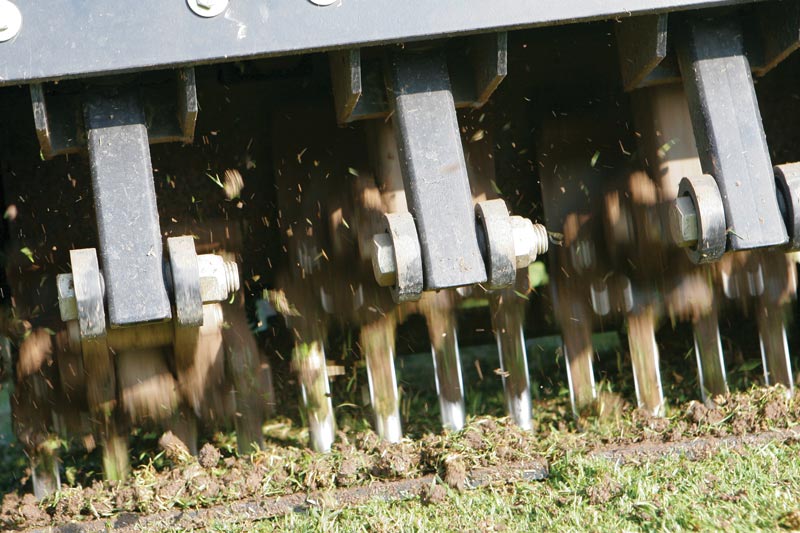 Aerifying turfgrass