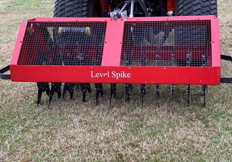 Turf slicer spiker machine