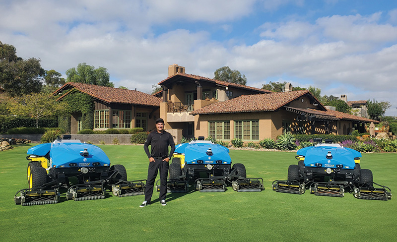 Miller outdoors with three autonomous fairway mowers