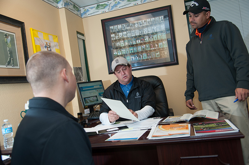 superintendent and team discussing an issue in an office