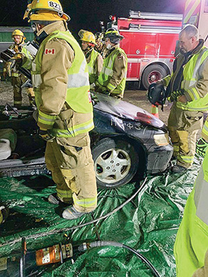 Tim Webb putting out a fire as a volunteer firefighter