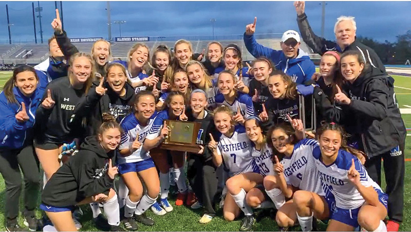 Chris Carson with a girls high school varsity team during a game