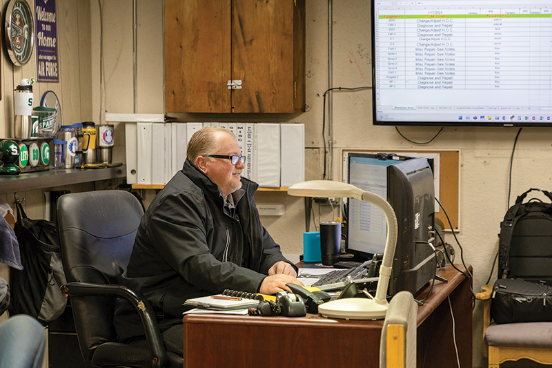 Ron McCall working at his desk