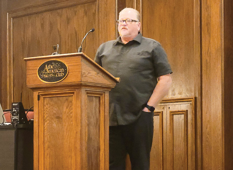 McCall speaking at a podium