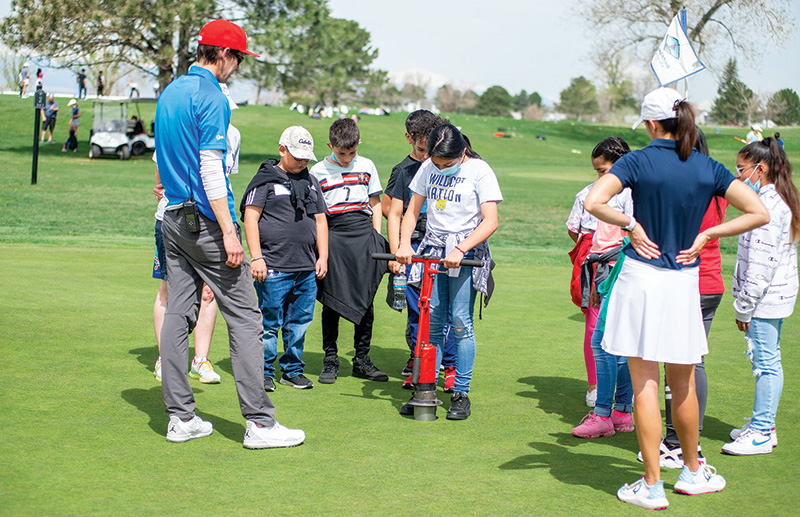 Mitch Savage with children during a field trip