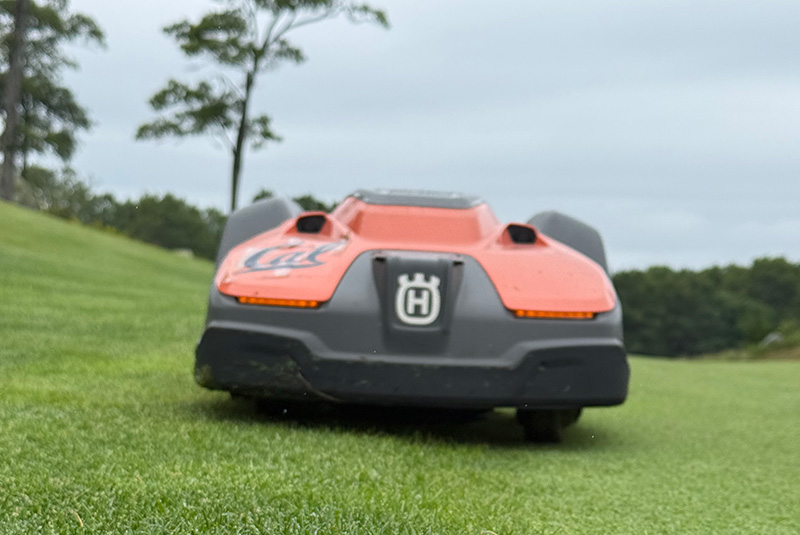orange and black Husqvarna autonomous mower