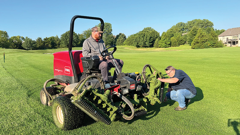 Mark Williams inspecting a fairway mower