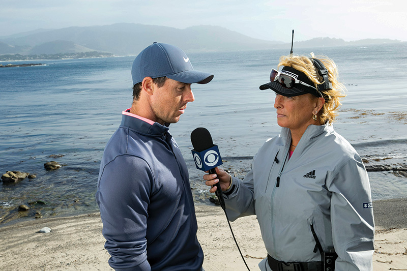 Rory McIlroy, left, speaking outside with Dottie Pepper, right