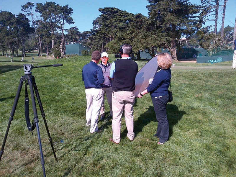 Drasler in 2012, being interviewed on a golf course by a TV crew.