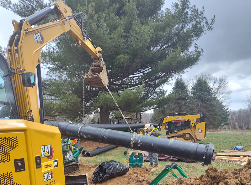 Man working on an in-ground irrigation system
