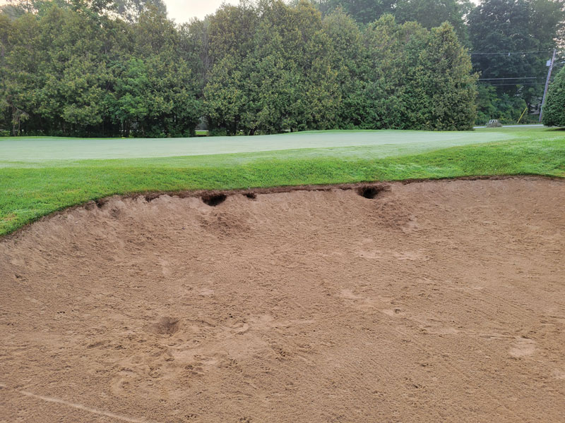 Photo Quiz: Holes in bunker, indentations on green Holes in bunker