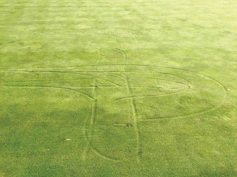 Photo Quiz: Holes in bunker, indentations on green Indentations golf green