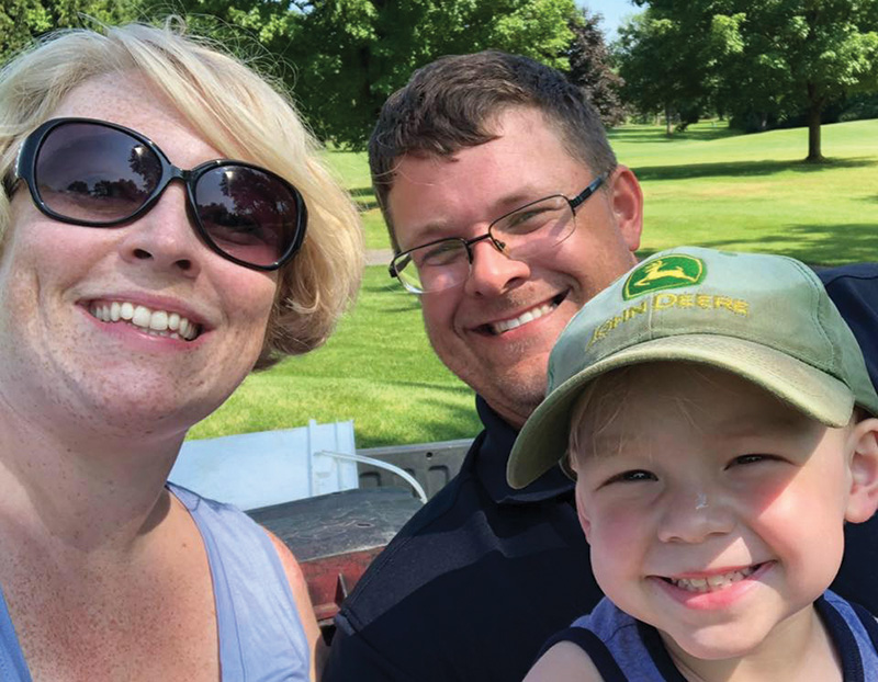 David Morrow with his wife and young son